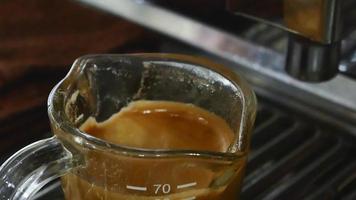Close-up of espresso pouring from coffee machine video