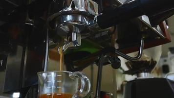 Hands of young woman barista was pressing the start button on the coffee machine video