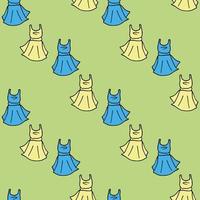 Seamless pattern with blue and yellow dresses on green background. Vector image.