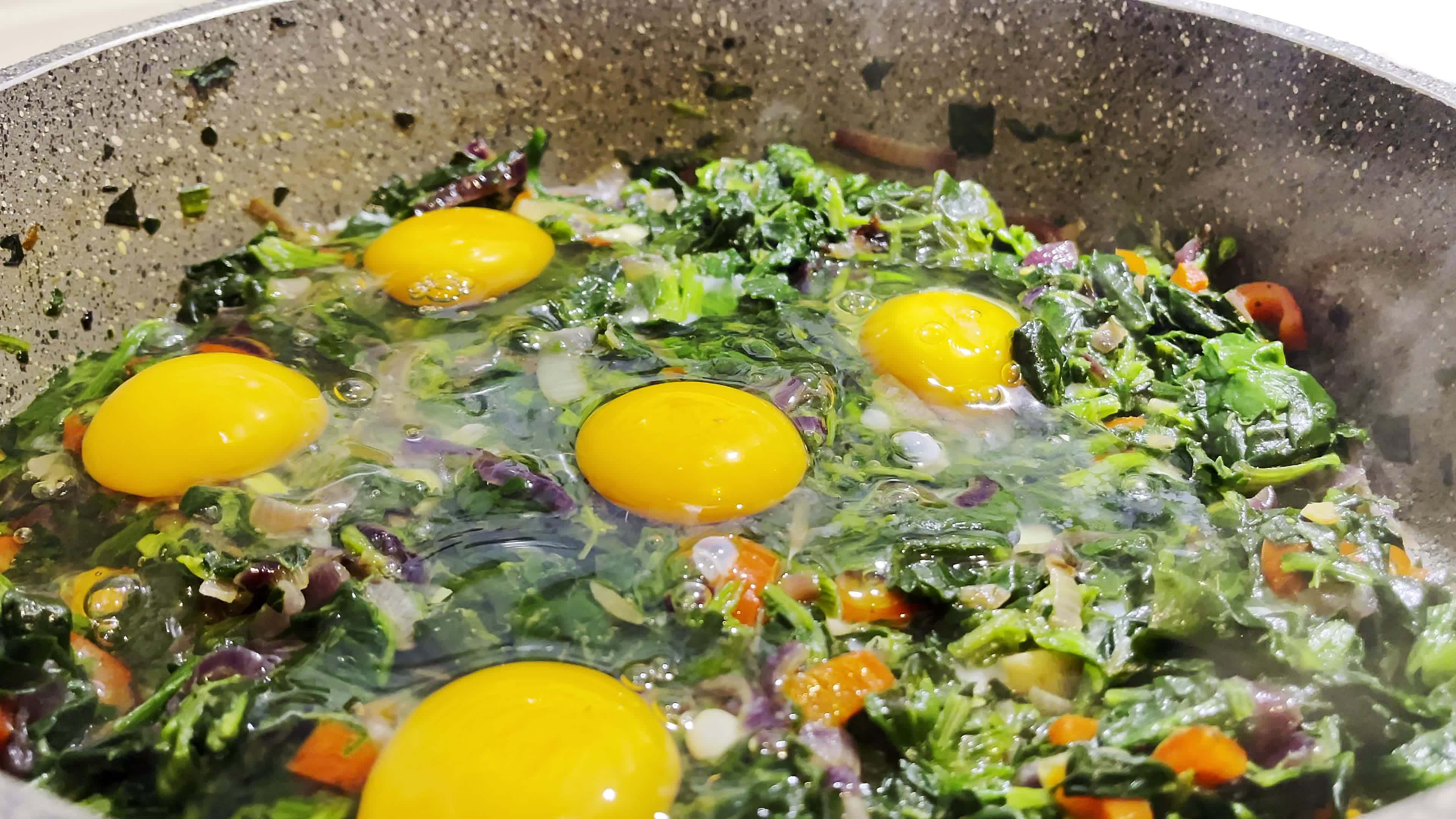 Pan fried spinach with egg 7883726 Stock Video at Vecteezy