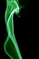 Green smoke on black background photo