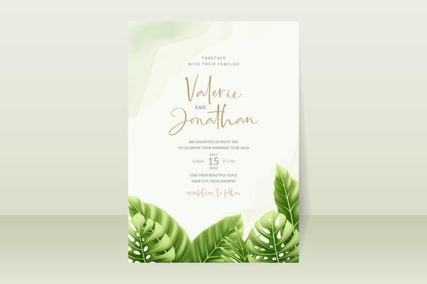 Wedding invitation concept with realistic tropical leaves