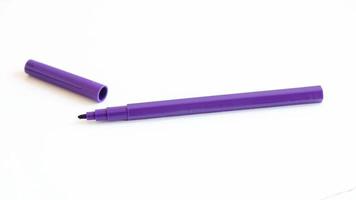 Purple felt-tip pen on a white background photo