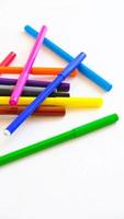 Multicolored felt-tip pens on a white background photo