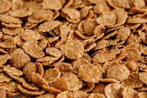 Crispy healthy dry cereal flakes as a background texture photo