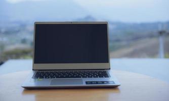 Computers placed on a desk for working on the go photo