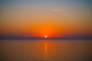 Seascape with a beautiful sunset over the sea photo