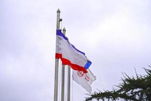 Simferopol, Crimea-June, 6, 2021-Flags of the Crimea and the Crimean railway against the sky. photo