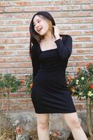 portrait of a beautiful woman in a black dress photo