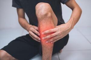 A man with a painful leg photo
