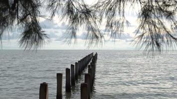 Broken bridge pillar at sea coastal view video