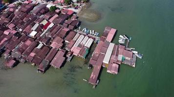 Aerial view look down clan jetty of wooden stilt house video