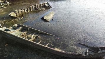 Rusty broken wooden boats sink at coastal video