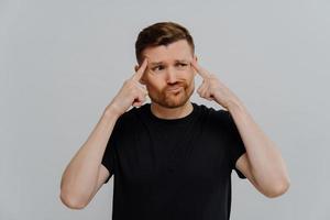 Man trying to make decision or find solution photo