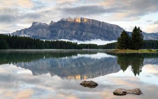 Mount Rundle and Two Jack Lake with early morning mood, Banff National Park, Alberta, Canada photo