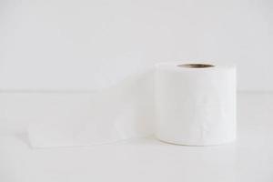 Roll of white toilet paper on a white background photo