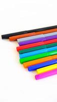 Multicolored felt-tip pens on a white background photo