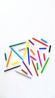 Multicolored felt-tip pens on a white background photo