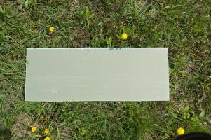 Sign for inscriptions and drawings on the grass photo
