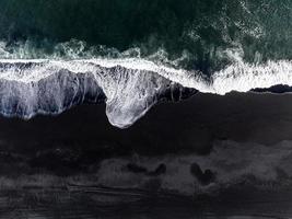 Aerial view of the Iceland coastline by the black beach. photo