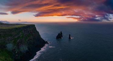 Iceland black sand beach with huge waves at Reynisfjara Vik. photo