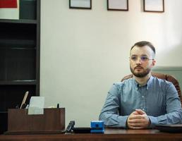 Businessman working on his laptop in an office photo