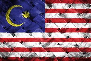 malaysia flag screen on wicker wood background photo