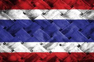 Thailand flag screen on wicker wood background photo