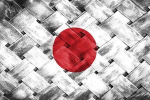 pantalla de bandera de Japón sobre fondo de madera de mimbre foto