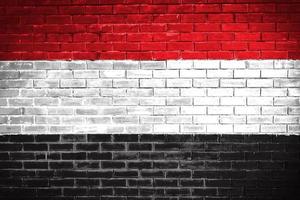 fondo de textura de pared de bandera de yemen foto