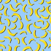 Seamless vector pattern of yellow bananas on a blue background.