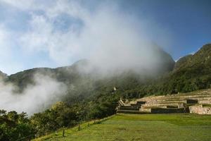 Wonder of the World Machu Picchu in Peru. Beautiful landscape in Andes Mountains with Incan sacred city ruins. photo