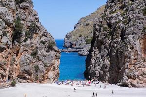 Beautiful beach with very clean and azure water on the mediterranean sea in the island of Ibiza, Spain. photo