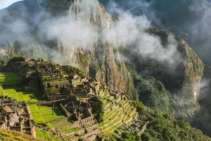 Wonder of the World Machu Picchu in Peru. Beautiful landscape in Andes Mountains with Incan sacred city ruins. photo