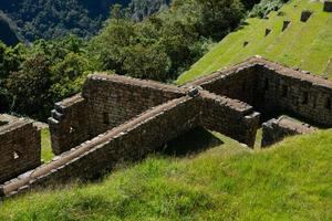 Wonder of the World Machu Picchu in Peru. Beautiful landscape in Andes Mountains with Incan sacred city ruins. photo