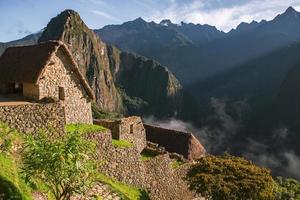 Wonder of the World Machu Picchu in Peru. Beautiful landscape in Andes Mountains with Incan sacred city ruins. photo