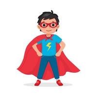 Cute little boy plays wearing superhero costumes standing with hands on his hips pose vector