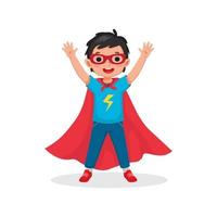Cute little boy plays wearing superhero costumes standing raising hands greeting with smiling welcome vector