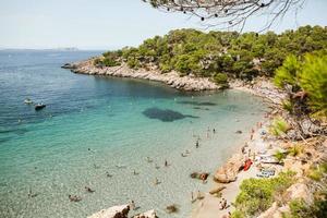 Beautiful beach with very clean and azure water on the mediterranean sea in the island of Ibiza, Spain photo