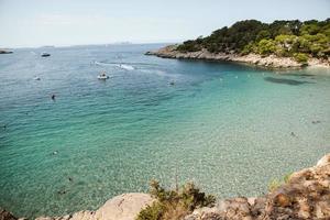 Beautiful beach with very clean and azure water on the mediterranean sea in the island of Ibiza, Spain photo