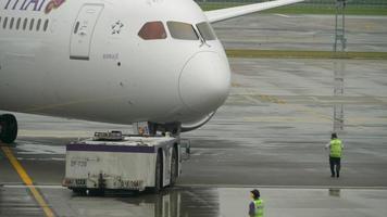 Airliner pushing back before departure video