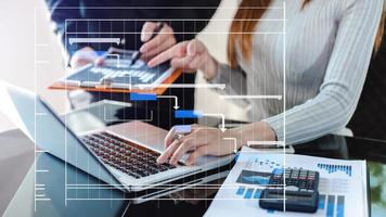 Project manager working and update tasks with milestones progress planning and Gantt chart scheduling diagram. business working with smart phone, tablet and laptop in office. photo