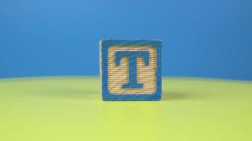 Close up shot letter T alphabet wooden block video