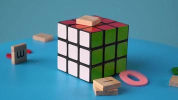 Alphabet block drop at rubik's cube video