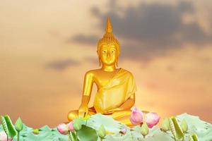 Buddha statue. background blurred flowers and sky with the light of the sun.Makha Bucha Day.Vesak Day.Asanha Bucha.Buddhist Lent. photo