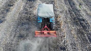 Tractor plowing in farm video