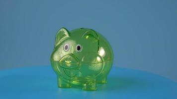 Transparent green piggy bank rotated video