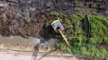 Aerial view fly away look down excavator video