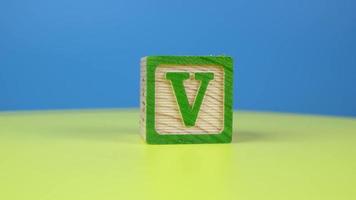 Close up shot letter V alphabet wooden block video