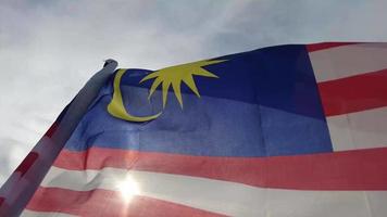 Malaysia flag wave at the background of sun video